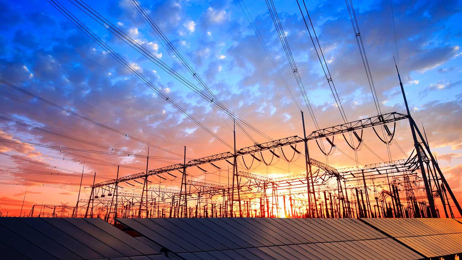 solar panels in front of power lines